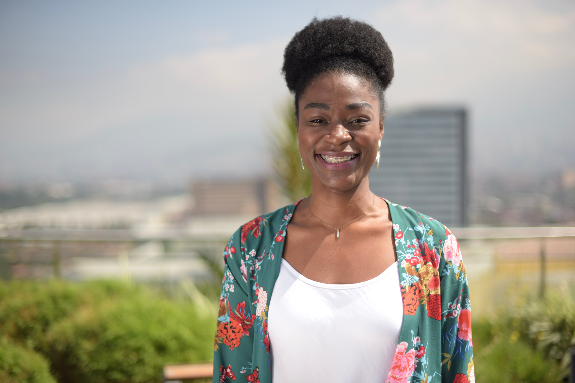 Summa team member smiling on the rooftop terrace